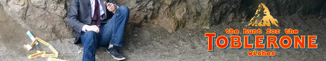 Hussie eating Toblerones outside of a cave with the text 'the hunt for the toblerone wishes' edited next to him.